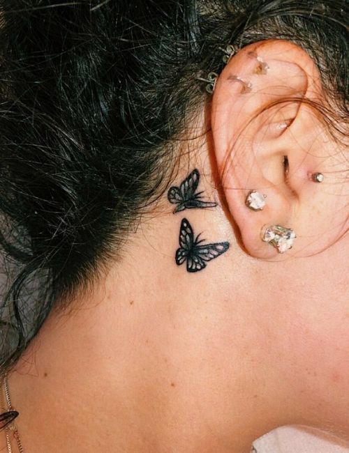 Near Ear small butterfly tattoo