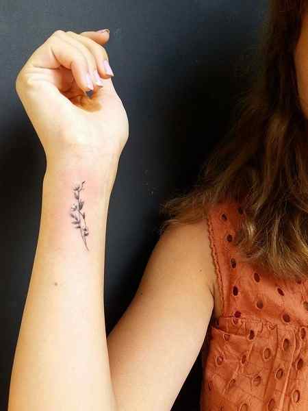 simple flower wrist tattoo